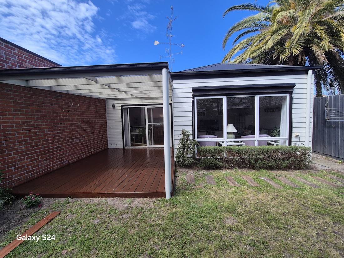 Weatherboard home with a restored deck in Northcote