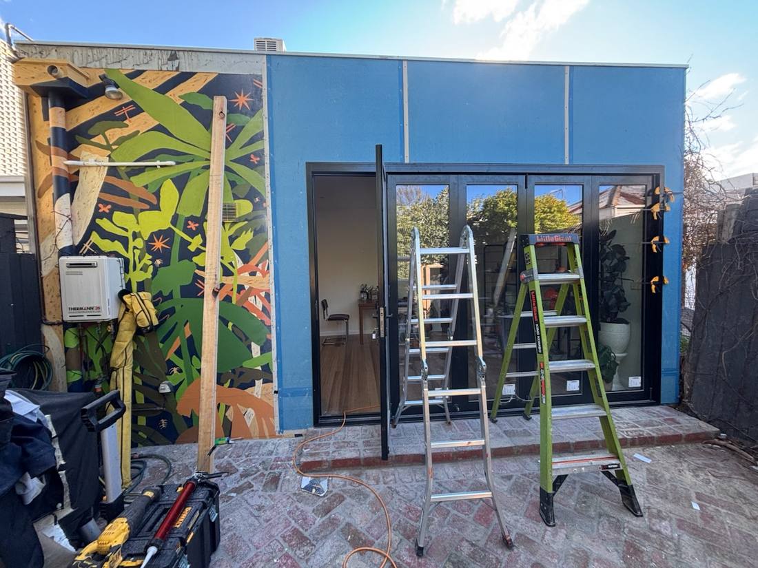 Elite Paint team working on a commercial site with access equipment