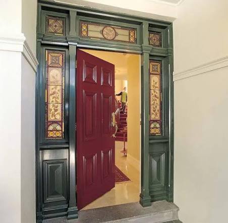 Restored ornate heritage front door with leadlight detail