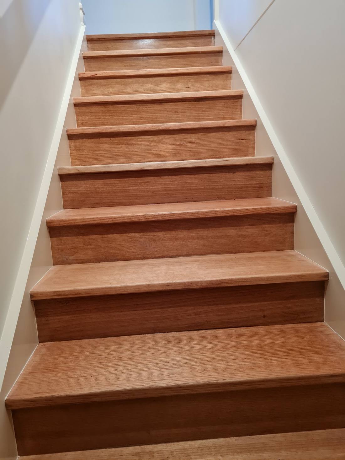 Timber staircase with crisp set and painted risers