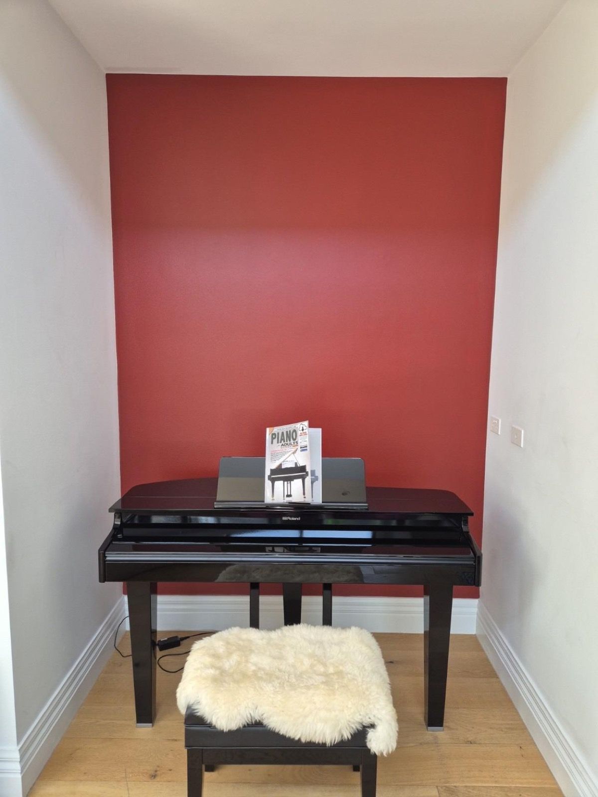 Restored red feature wall in a Brighton home